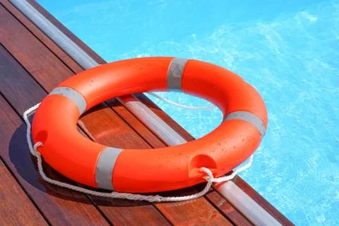 Red lifebuoy pool ring float Foto stock