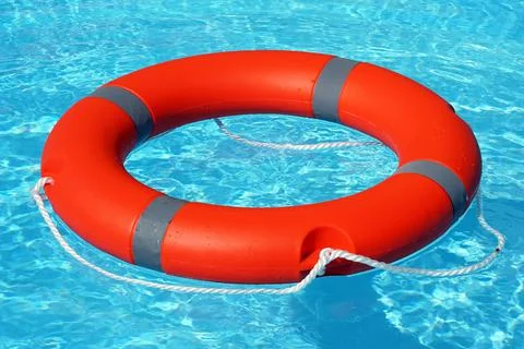 Red lifebuoy pool ring float Stock Photos