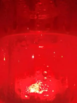 Red light background with subtle liquid texture background abstract Stock-Fotos