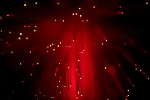 Red light beams pierce a dark void Stock Photos