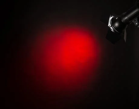Red light on black background Stock Photos