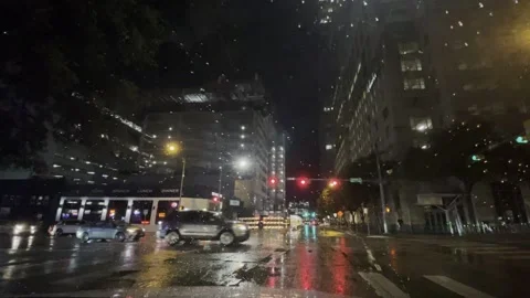 At the Red light, car passing Stock Footage 243531649