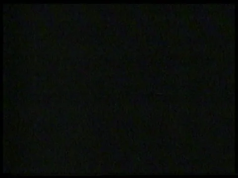 Red Light Glowing Inside a Dark Apartment Building Entrance Vídeo Stock 344996104