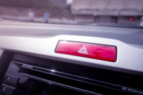 Red light hazard emergency button on a car console Stock Photos