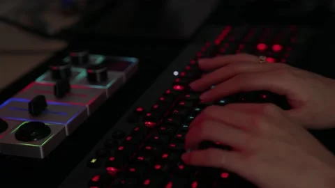 A red light keyboard typing hand. Stock Footage 167009683