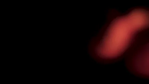 Red light leaks blurred footage on black background. Stock Footage