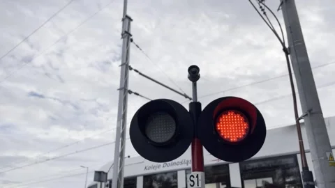 A red light is on a pole in front of a train Stock Footage 265209834