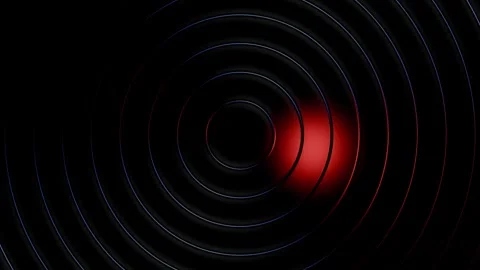 A red light spotlight rotates around dark concentric circular rings Stock Footage 346811155