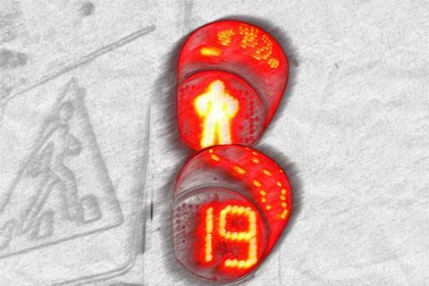 The red light of traffic light on the pedestrian crossing of a human silhouet Stock Photos