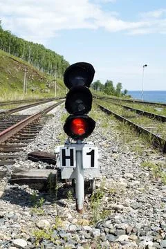 Red light at a traffic light on the tracks Stock Photos