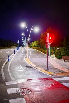 Red Light on Wet Cycle Path at Night Stock Photos