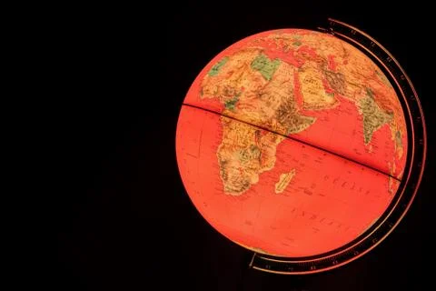 Red light world globe with black background Stock Photos