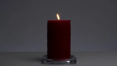 Red lighted candle Stock Footage 132862148