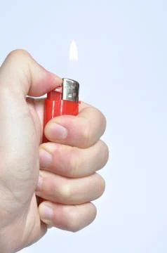 Red lighter in hand Stockfoto's