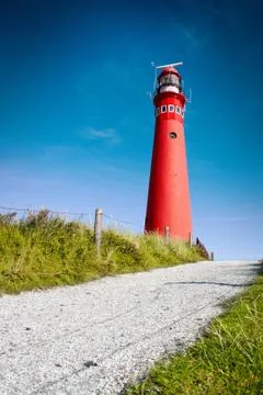 Red lighthouse and deep blue sky. 스톡 사진