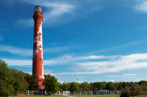 Red lighthouse on the blue sky Stock Photos