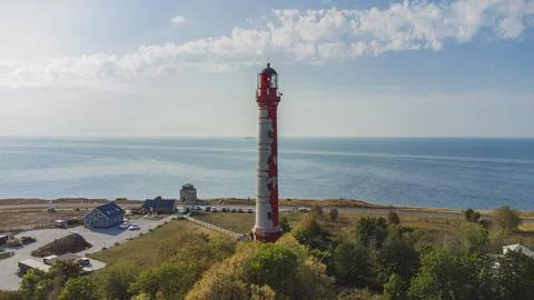 Red lighthouse on the sea Stock Photos