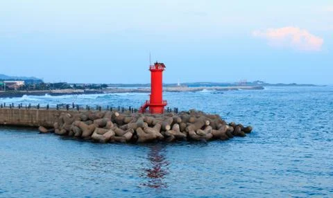 Red Lighthouse on the seawall Stock Photos