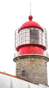 Red Lighthouse tower in a white sky. Stock Photos