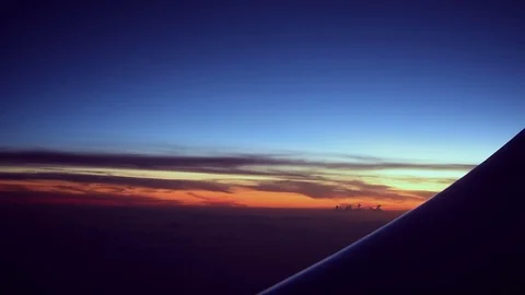 Red Lights Flicker on  Airplane Wing During Colorful Sunset Stock Footage 73610382