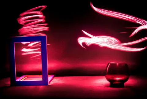 Red lights in motion with blue frame Stock Photos