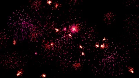 Red lights, multiple fireworks explosion, holiday night sky Stock Footage 83654393
