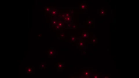 Red lights shine in dark space creating patterns and Stock Footage 338280187