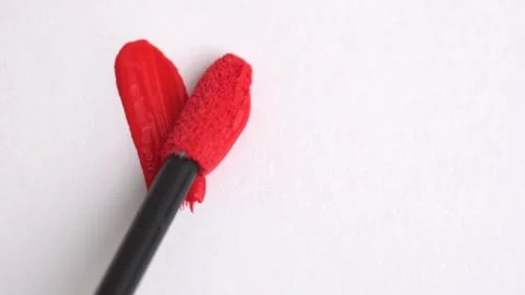 Red lipgloss stroke. Classic red lipstick, lip gloss texture in heart shape.. Stock Footage 265143725