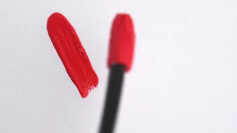 Red lipgloss stroke. Classic red lipstick, lip gloss texture in heart shape.. Stock Footage 266817857