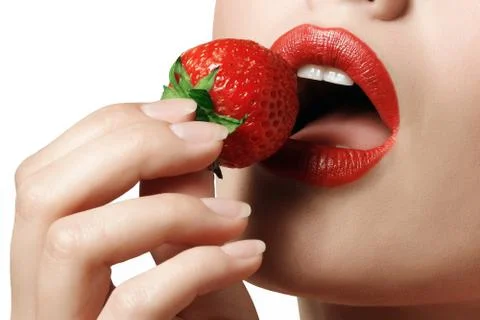 Red lips with strawberry Stock Photos