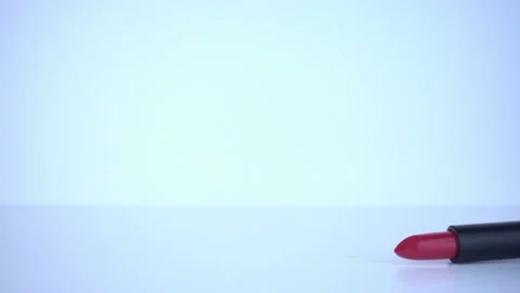 Red Lipstick falling in slow motion. Stock Footage 95564977