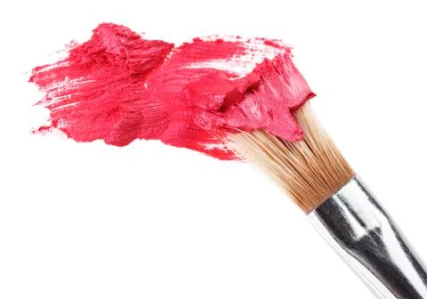 Red lipstick stroke (sample) with makeup brush, isolated on white Foto stock