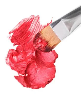 Red lipstick stroke (sample) with makeup brush, isolated on white Fotos Stock