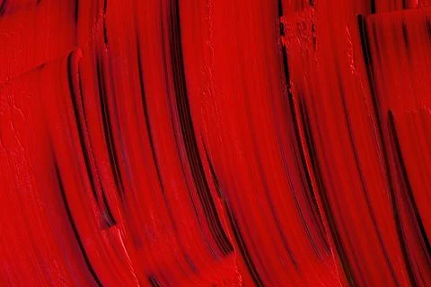 Red lipstick texture background. Vertical smears of red lipstick on black. Stock Photos