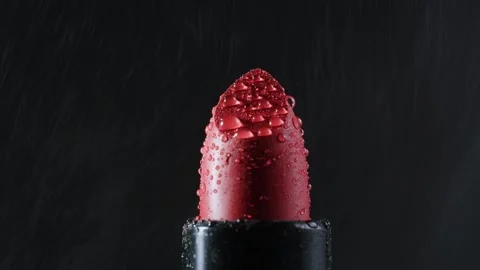 Red lipsticks make up close up macro background with smoke and water drops Stock Footage 255613026