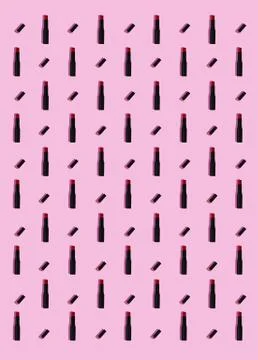 Red lipsticks pattern on pink background Stockillustratie