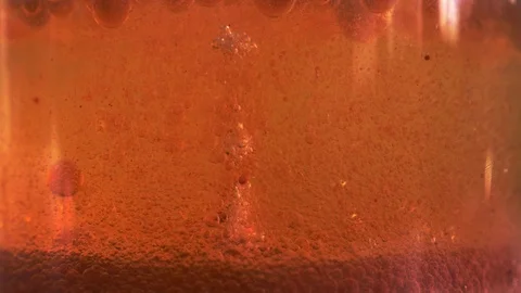 Red liquid with air bubbles Stock Footage 97848596