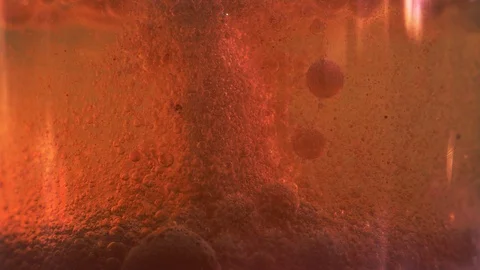 Red liquid with air bubbles Stock Footage 97891054