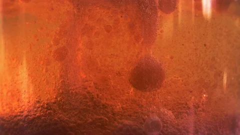 Red liquid with air bubbles Stock Footage 97891895