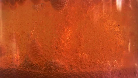 Red liquid with air bubbles Stock Footage 97938719