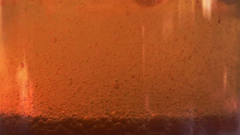 Red liquid with air bubbles Stock Footage 98056919