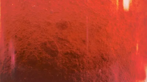 Red liquid with air bubbles Stock Footage 98057978