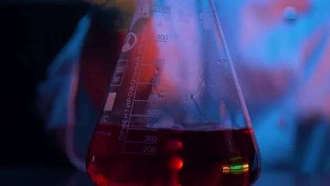 Red liquid boiling reaction in combination with dry ice. Scientific experience. Stock Footage 143335669