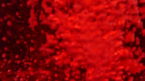 Red liquid with bubbles and debris. Video stock 165125514