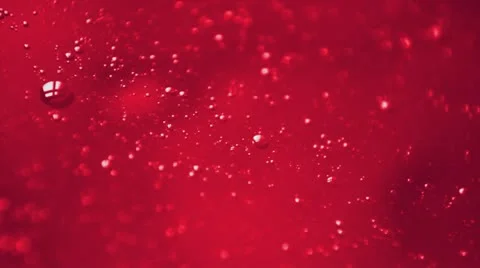 Red liquid with bubbles Stock Footage 20689006