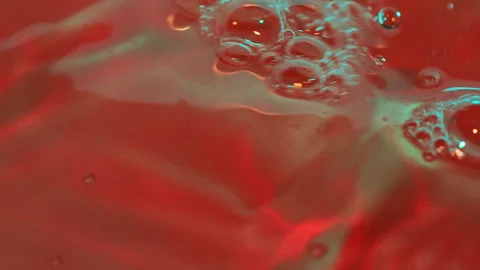 Red liquid with bubbling effervescence 動画素材 347177211
