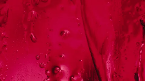 Red Liquid Gel Texture with Flowing Drops and Bubbles Stock Footage 346787024