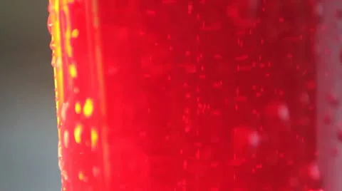 Red liquid in a glass - bubbles, slower motion Stock Footage 11883213
