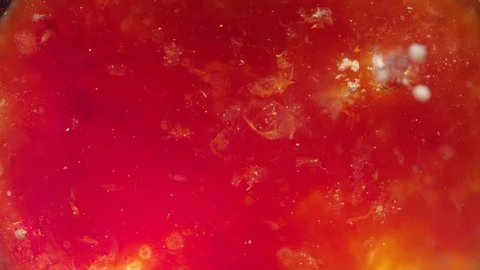 Red liquid lava bubbling up to the planet surface texture background Video stock 118286682