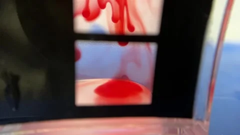 Red liquid mixes with water Stock Footage 278522758